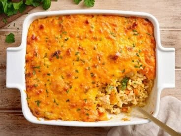 Overhead view of chicken and rice casserole with a spoon.